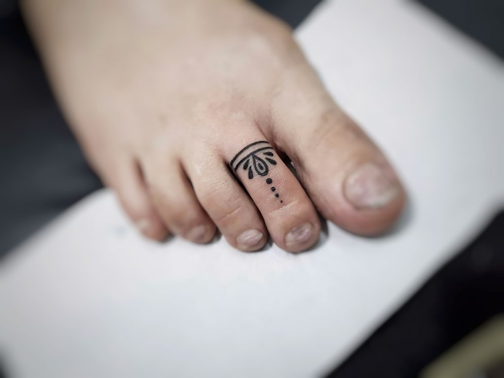 Toe ring tattoo, minimal tattoo by sumina shrestha- best female tattoo artist in nepal