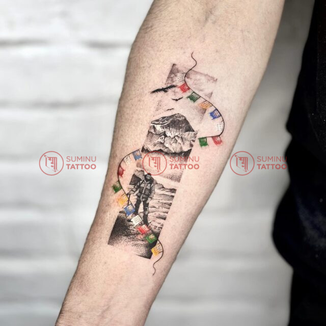 mountain travel tattoo,suminu tattoo, in nepal , himalaya mountains with prayer flags